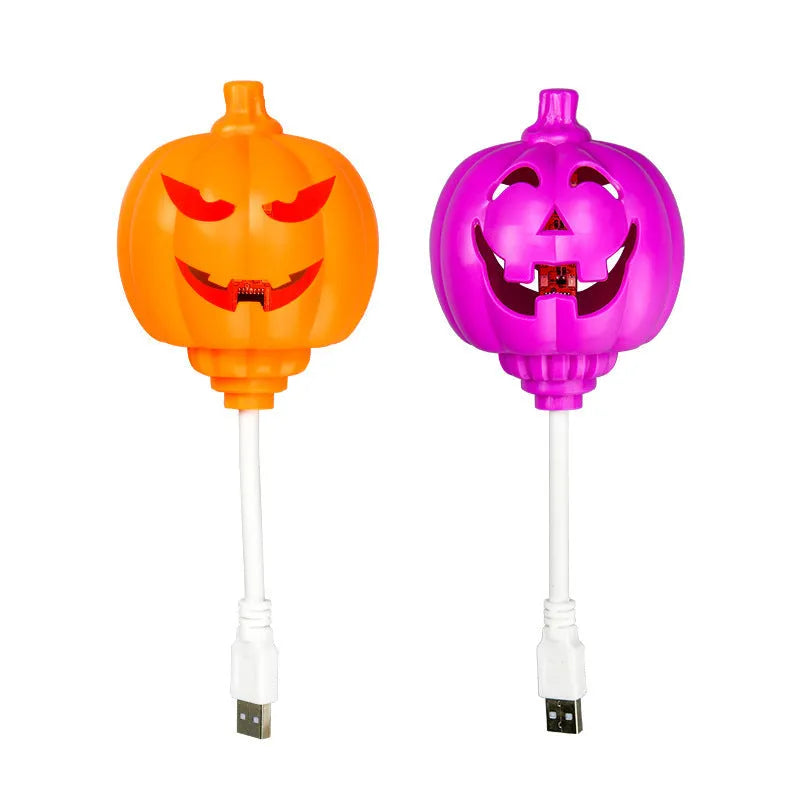 Plastic pumpkin lamp with USB charging cable showing yellow and purple light options