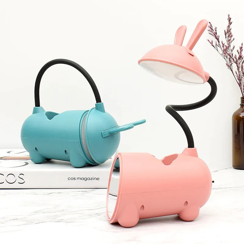 Cartoon-themed USB desk lamp with pen container in dark blue, green, or pink colours
