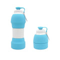 Blue silicone folding water bottle shown expanded and collapsed next to backpack for size comparison