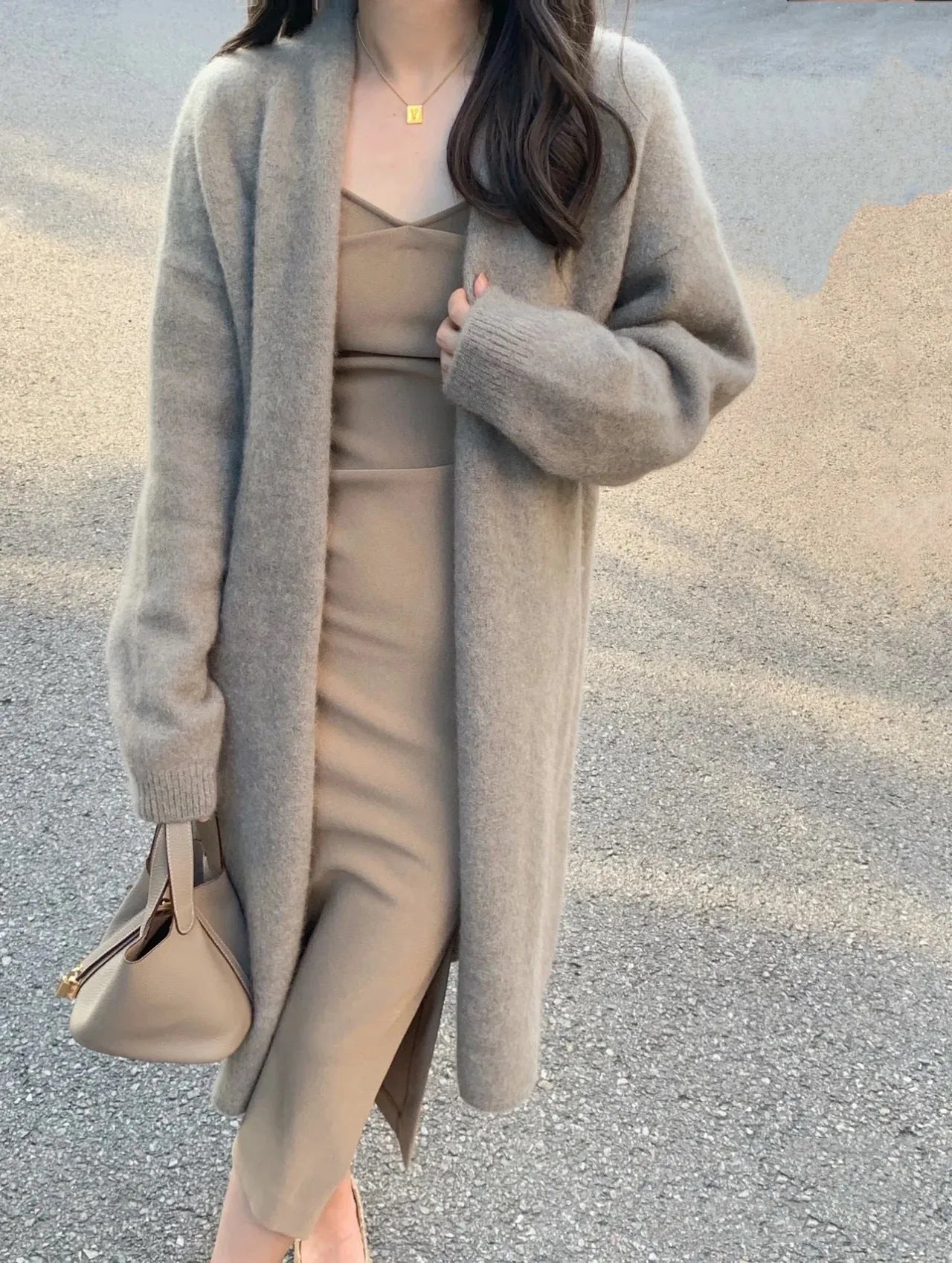 Women's loose fit V-neck knitted cardigan in a mid-length style, shown in a choice of colours.