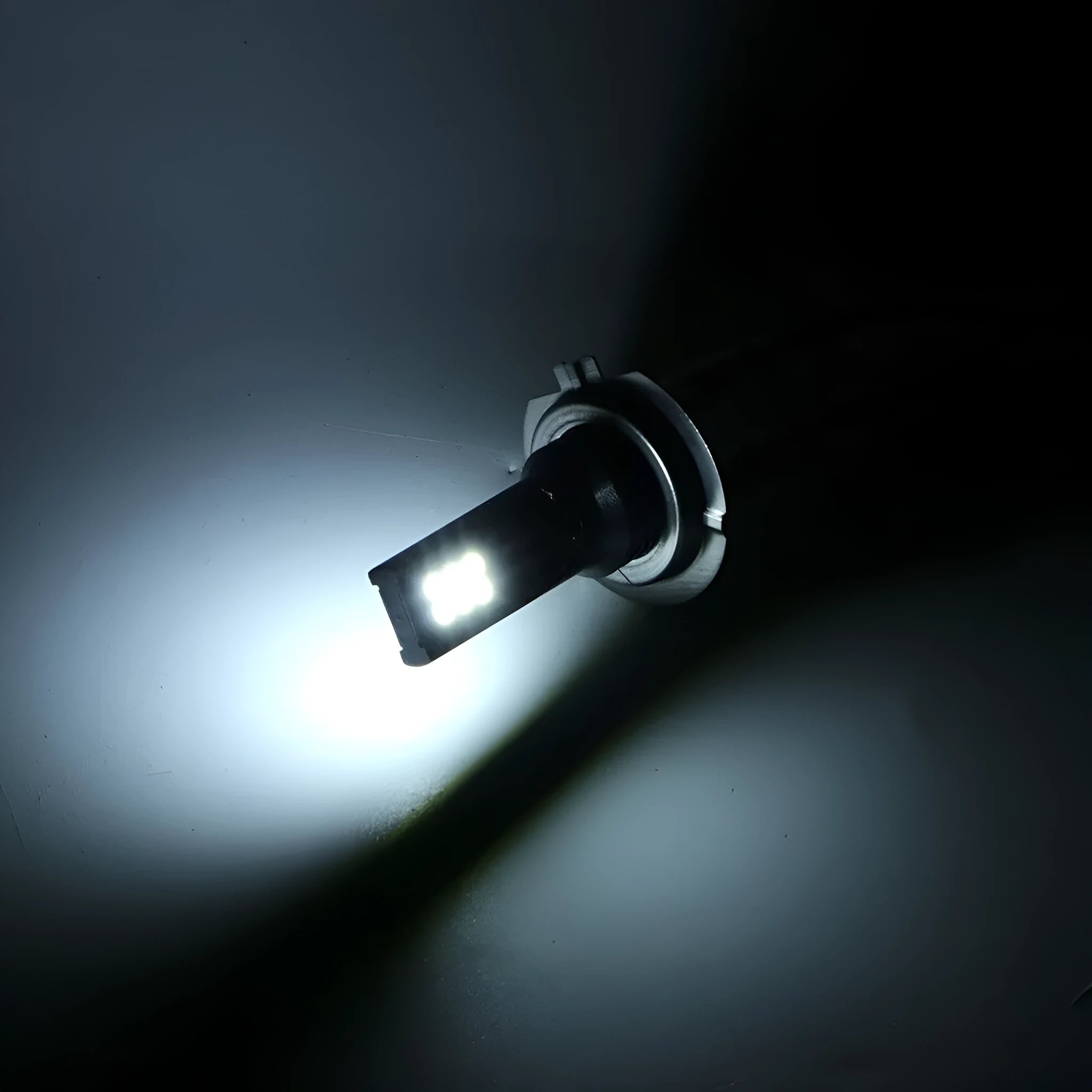 Single H7 110W LED car fog light bulb with 12 SMD LEDs and aluminium housing, showing white finish.