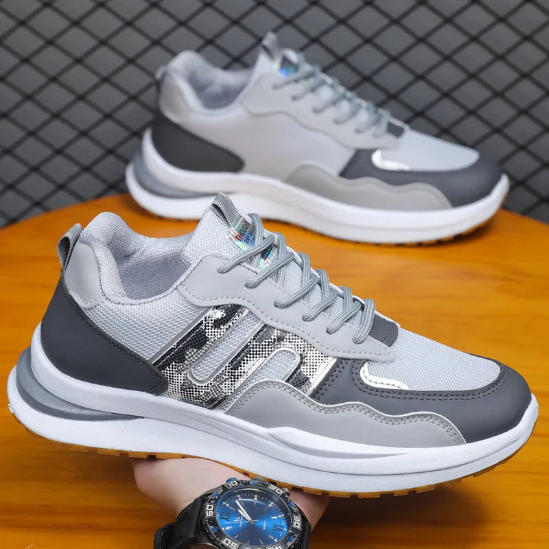 Men's white green mesh sports casual shoe with leather toe holder on a plain background.
