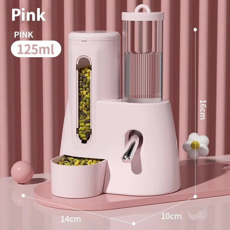 White, blue, and pink automatic hamster water feeder with attached food basin.