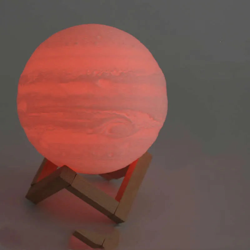 3D printed white moon lamp with textured surface on a wooden stand, showing touch ring at base