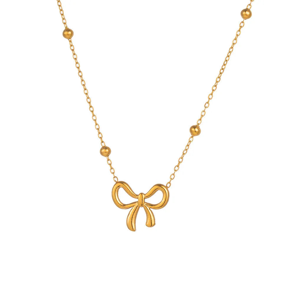 Gold electroplated titanium steel necklace with bow design and cross chain links