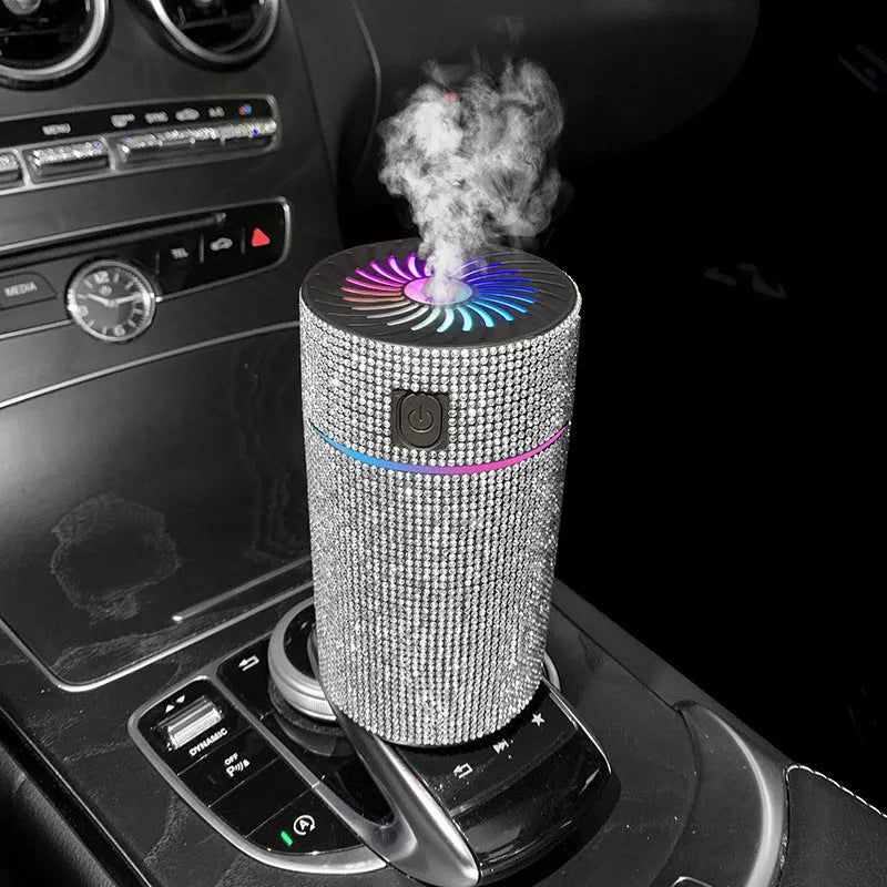 Compact white car USB air humidifier on a car dashboard.