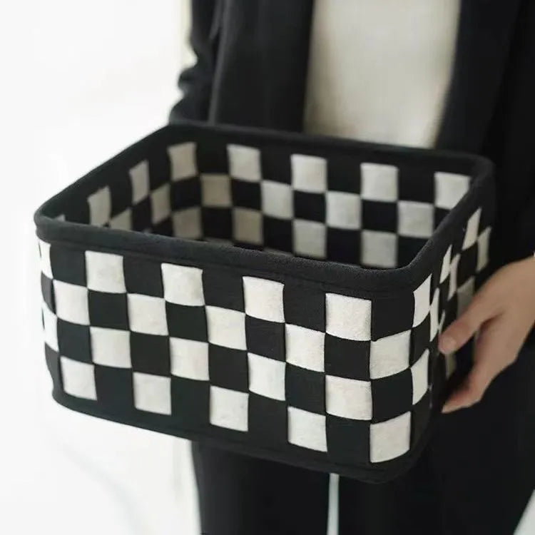 Grey checkerboard patterned folding felt storage basket with dimensions 37cm by 29cm.