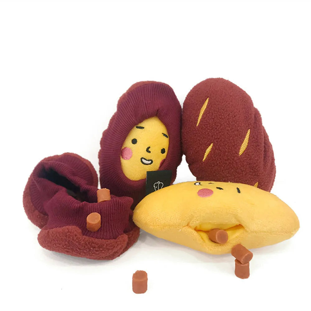 Red sweet potato-shaped dog toy with hidden food pockets and wrap-up design for treat puzzles.