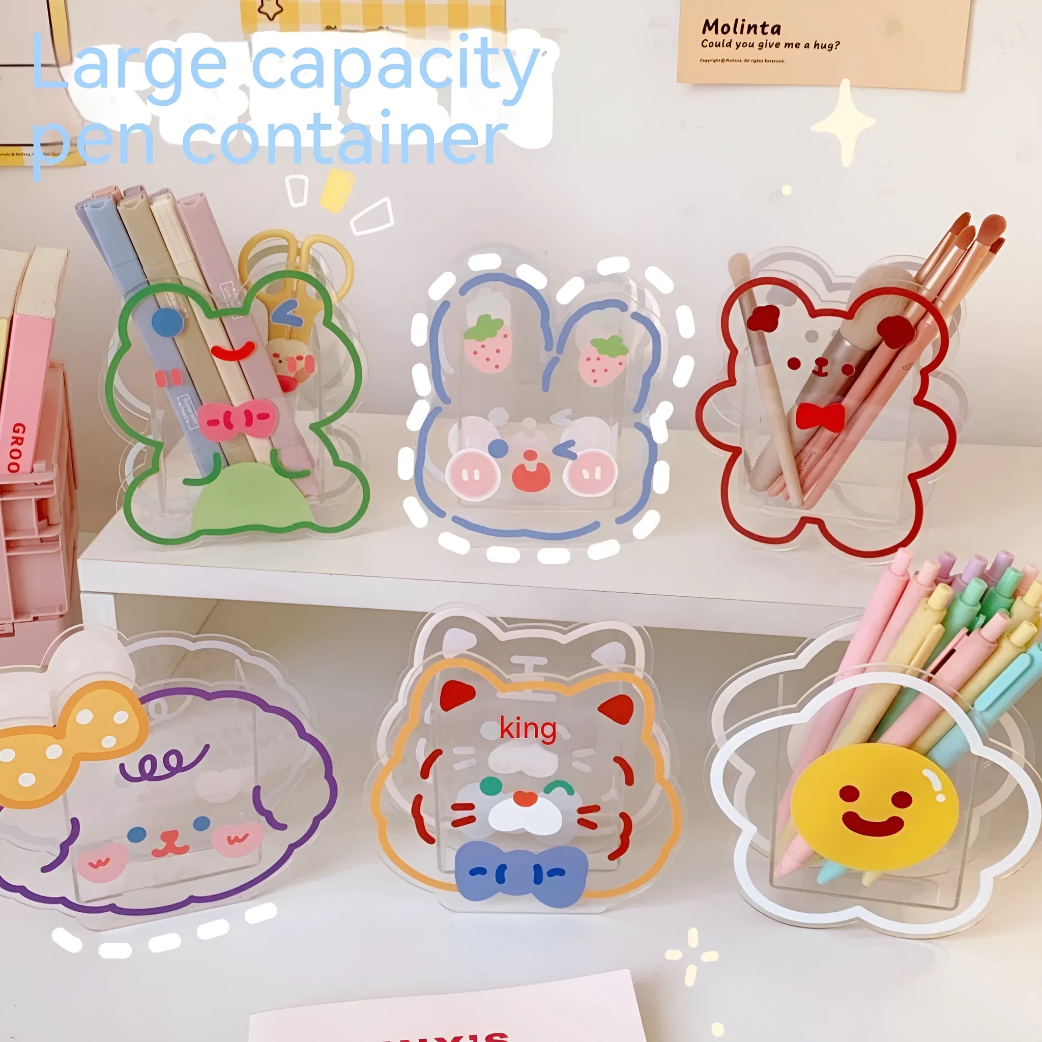 Clear square acrylic storage box with a cute cartoon rabbit design, sitting on a wooden desk.
