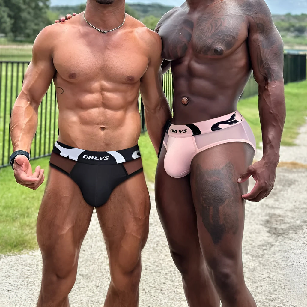 Men's solid colour modal boxer shorts with a low waist design, shown in black, pink, and red.
