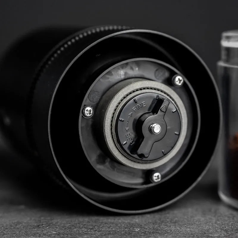 Portable black electric coffee grinder with transparent chamber and USB-C charging cable