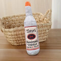 Brown plush wine bottle shaped dog toy with squeaker for puppies and small dogs