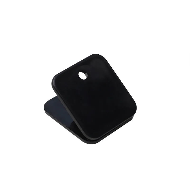 Set of five small square plastic note holders in white, black, and transparent colours