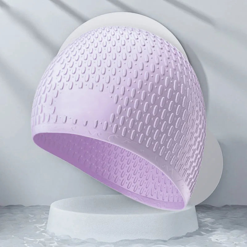 Silicone water drop swimming cap for adults in various solid colours on white background