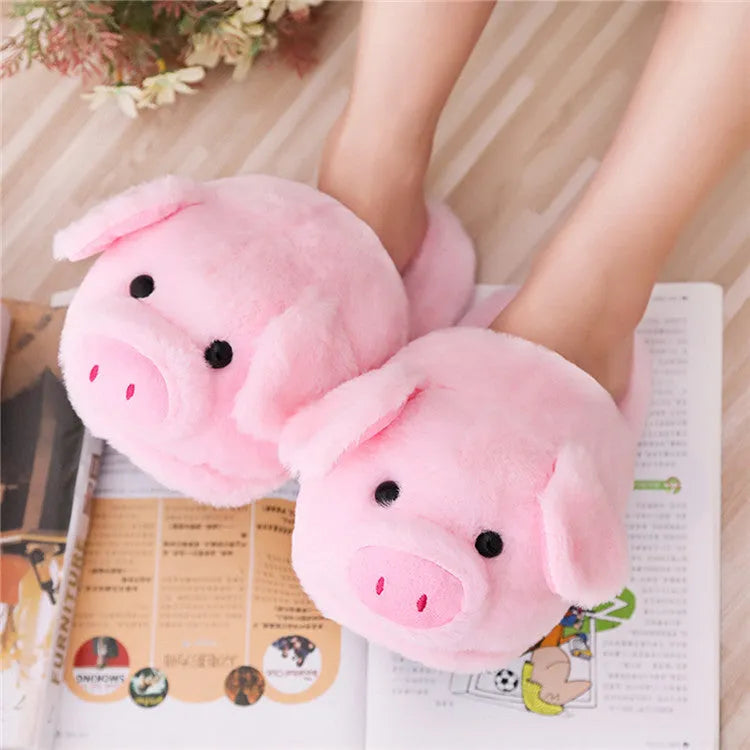 Pink adult pig slippers with short plush lining and a size chart showing international conversions.