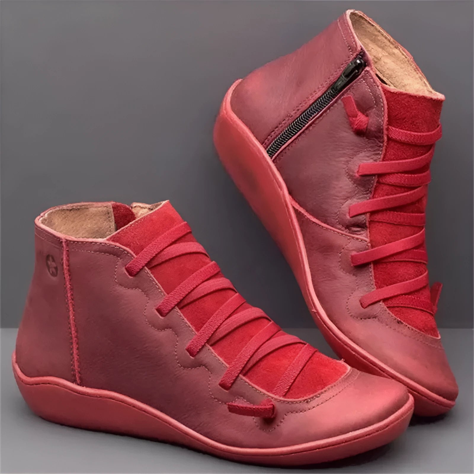 Women's casual flat ankle boots in artificial PU leather with a round toe and wedge rubber sole.