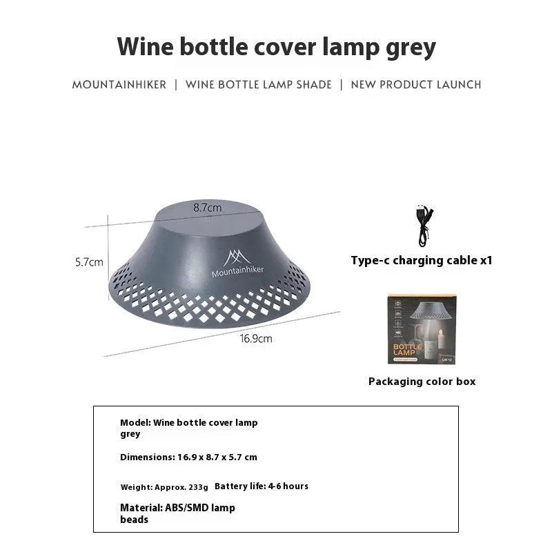 Beige recycled wine bottle camping lantern with USB-C port, showing warm light glow.