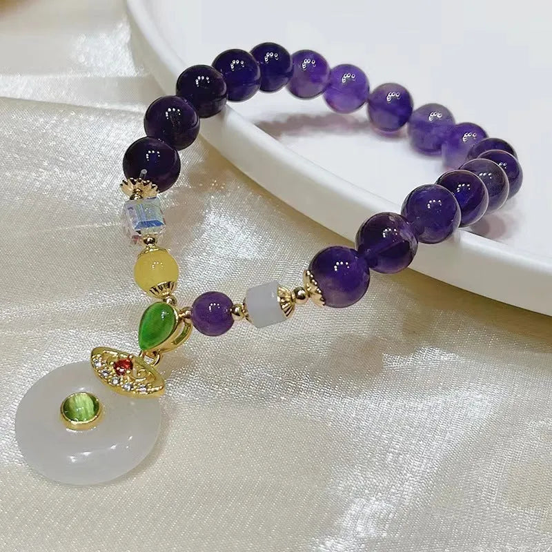 Purple amethyst crystal bracelet with geometric beads showing money bag charm and peace buckle pendant options