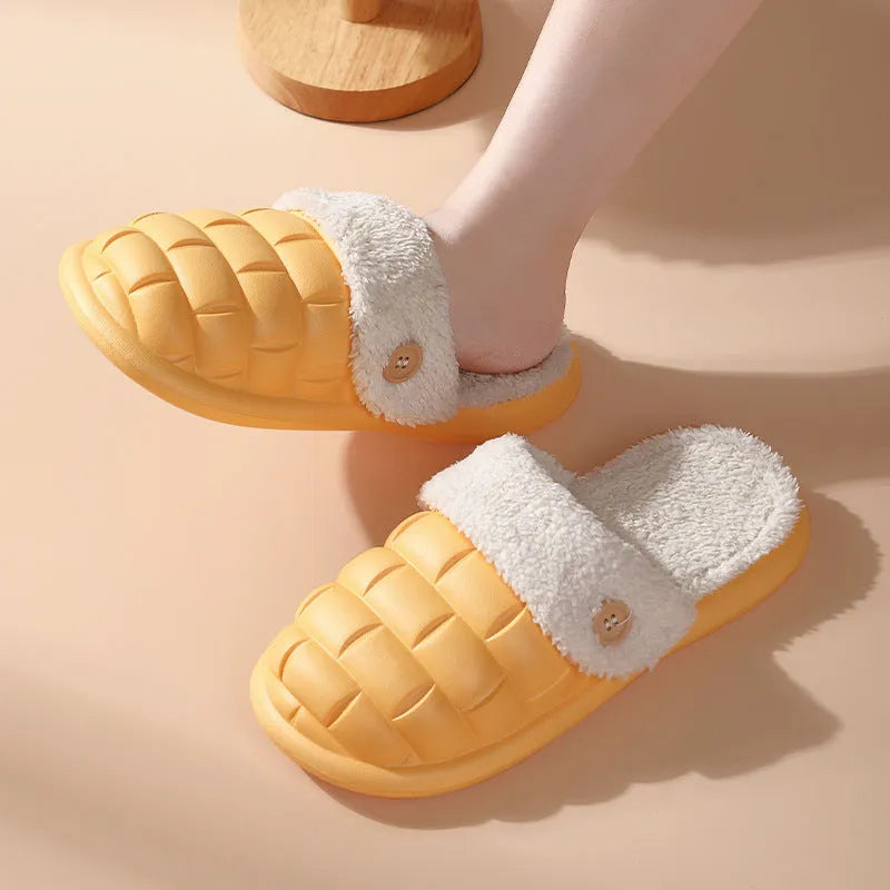 Plaid detachable EVA slippers with plush lining in pink, shown on a foot.