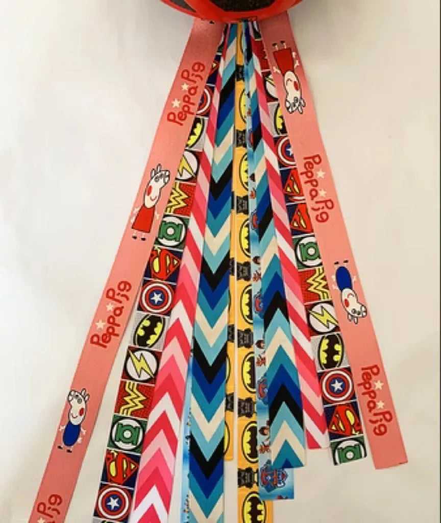 Set of colourful ribbon streamers attached to a child's helmet for roller skating.