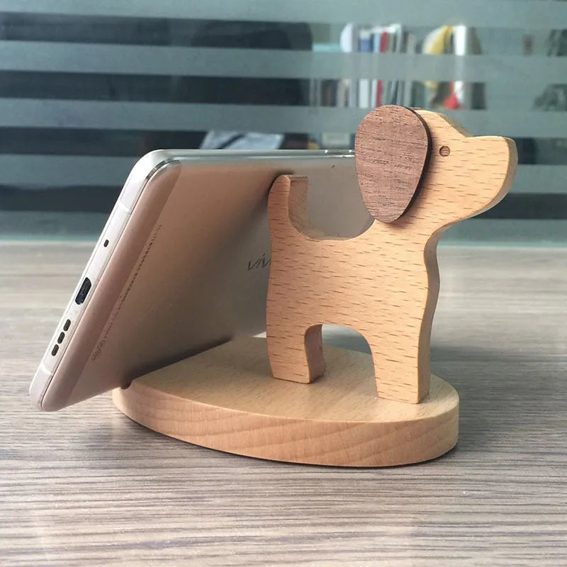 A decorative resin mobile phone stand holding a smartphone, shown in an animal design variant.