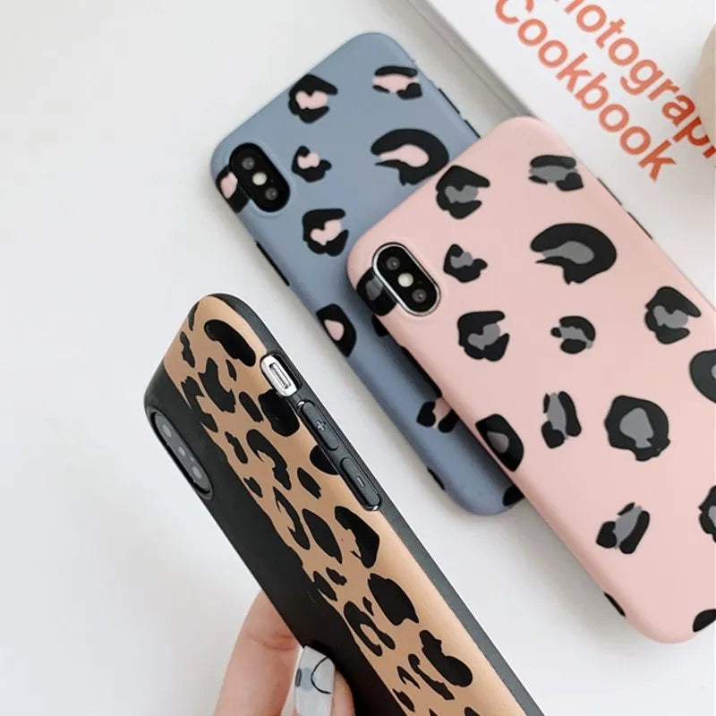 Leopard print pattern phone case for iPhone, shown in black, blue, and pink colour options.