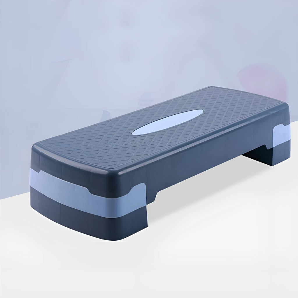 Grey Fit brand aerobic step platform on a floor for fitness exercises.