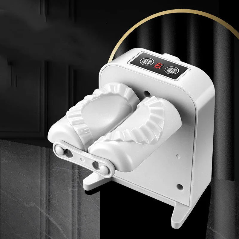 White automatic electric dumpling maker machine with USB charging cable on a kitchen counter