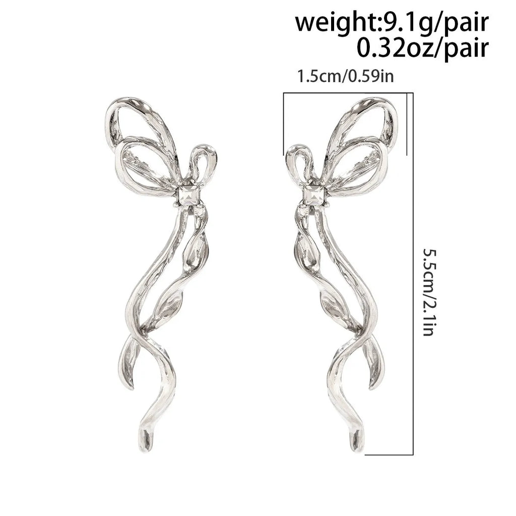 White K bowknot earrings for women, alloy electroplated bow-shaped earrings, one pair