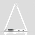 LED triangle table lamp with wireless charging pad and touch dimming controls in black