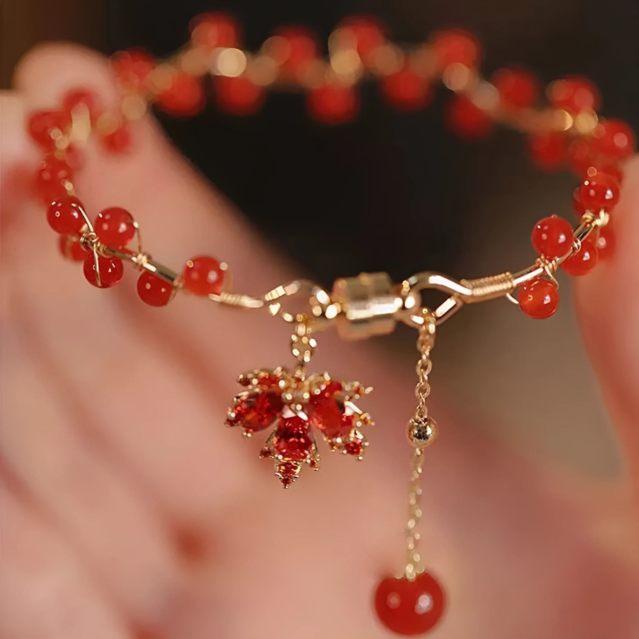 Red ginkgo leaf magnetic bracelet with electroplated alloy finish and adjustable sizing