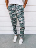Women's polyester pencil leggings with leopard print irregular colour-block pattern, mid-rise elastic waist