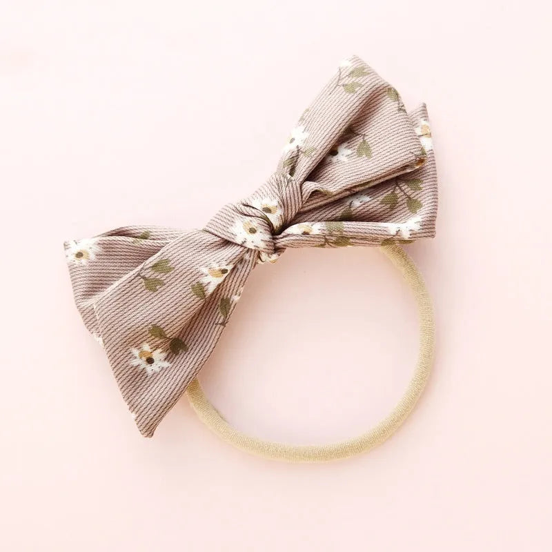Children's knotted bow hair band in cloth fabric with six colour options