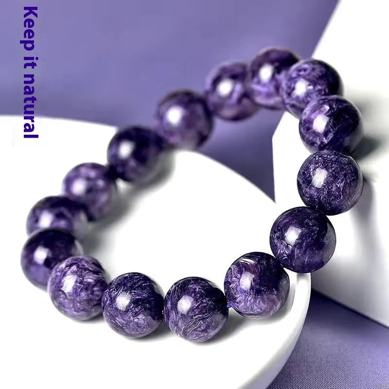 Natural transparent charoite crystal bracelet with platinum setting, showing different bead size options.
