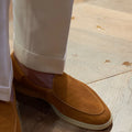Men's brown genuine leather handmade loafers flat shoes on a white background.