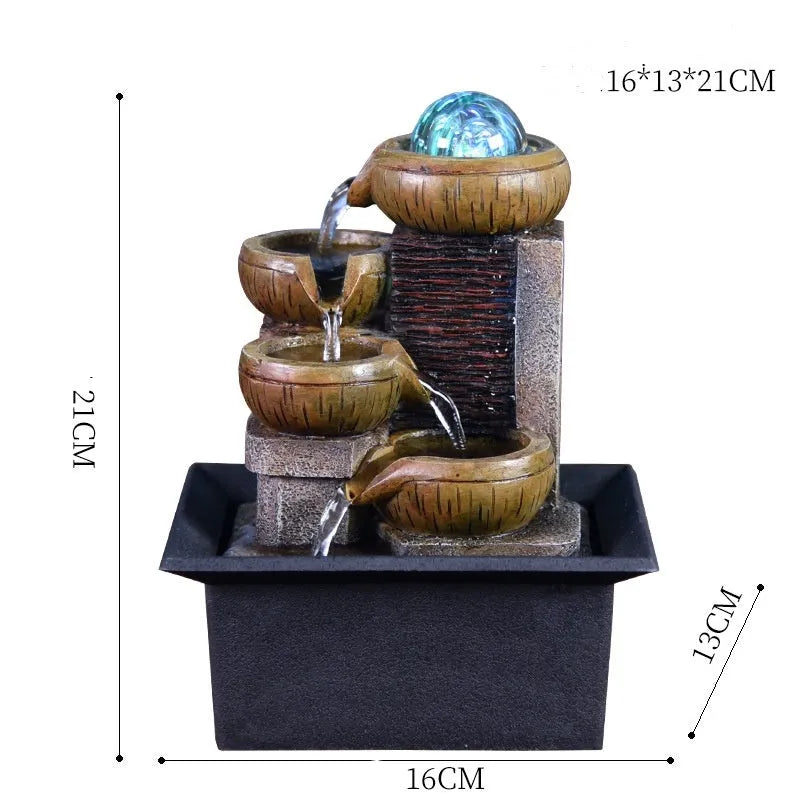 European desktop fountain with crystal ball and flowing water on a wooden desk