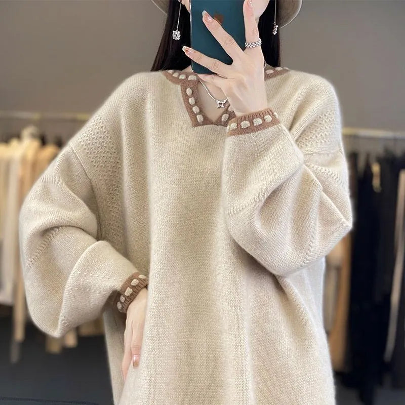 Women's camel V-neck viscose sweater with long sleeves on a hanger.