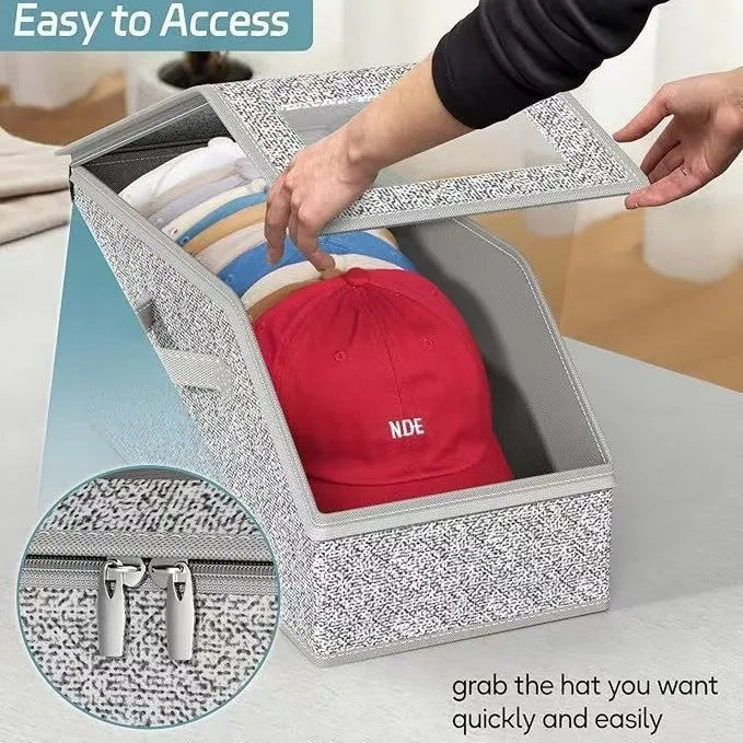Grey foldable woven fabric storage box with lid, shown next to baseball caps.