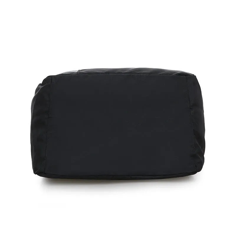 Black nylon backpack gym bag, 30 x 17 x 56cm, with zip pocket and three carry modes