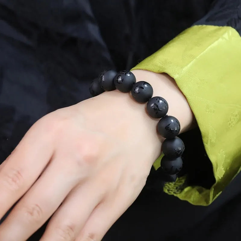 Natural frosted black agate Sanskrit mantra bracelet with Chinese auspicious patterns on beads.