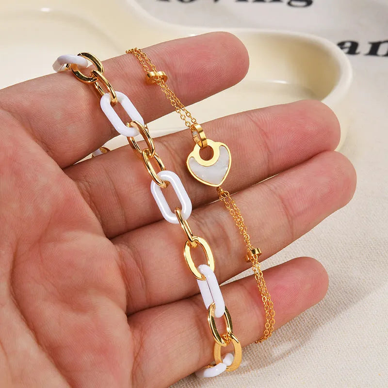 Women's stainless steel resin bracelet with a double-layer heart shape design.
