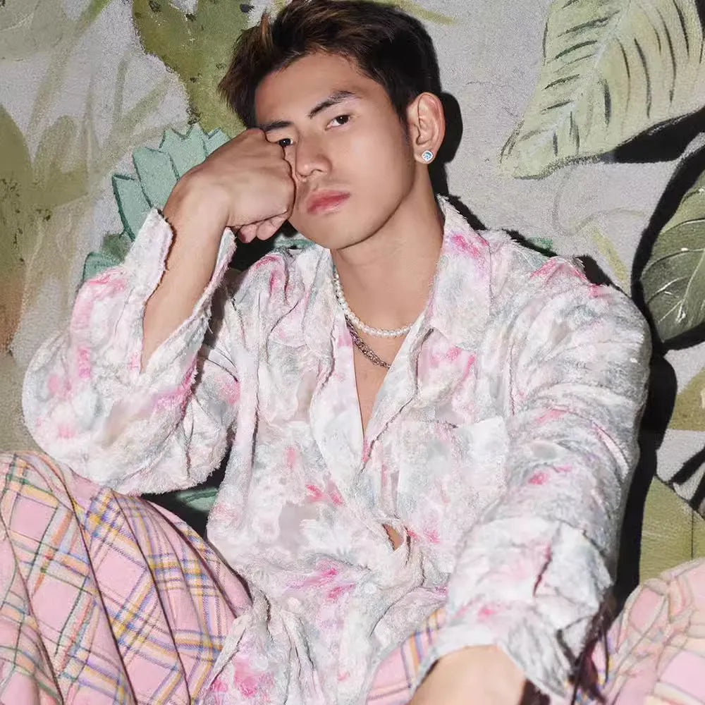 Women's pink floral long sleeve shirt with embossed pattern, shown in a loose fit.