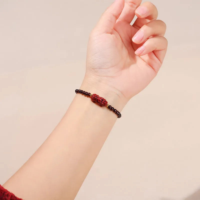 Natural garnet square bracelet with a carved purple sand and strawberry quartz Pixiu charm.