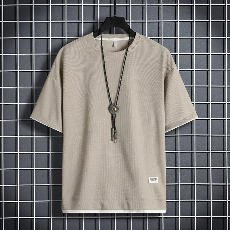 Half sleeve loose pullover top in polyester, available in seven colours and sizes M to 5XL