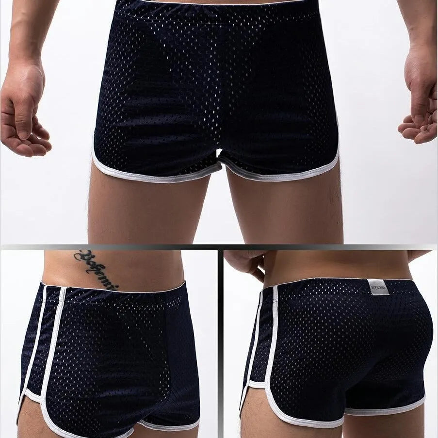 Men's solid-colour three-point boxer shorts laid flat, showing mid-waist band and three-point fly design.