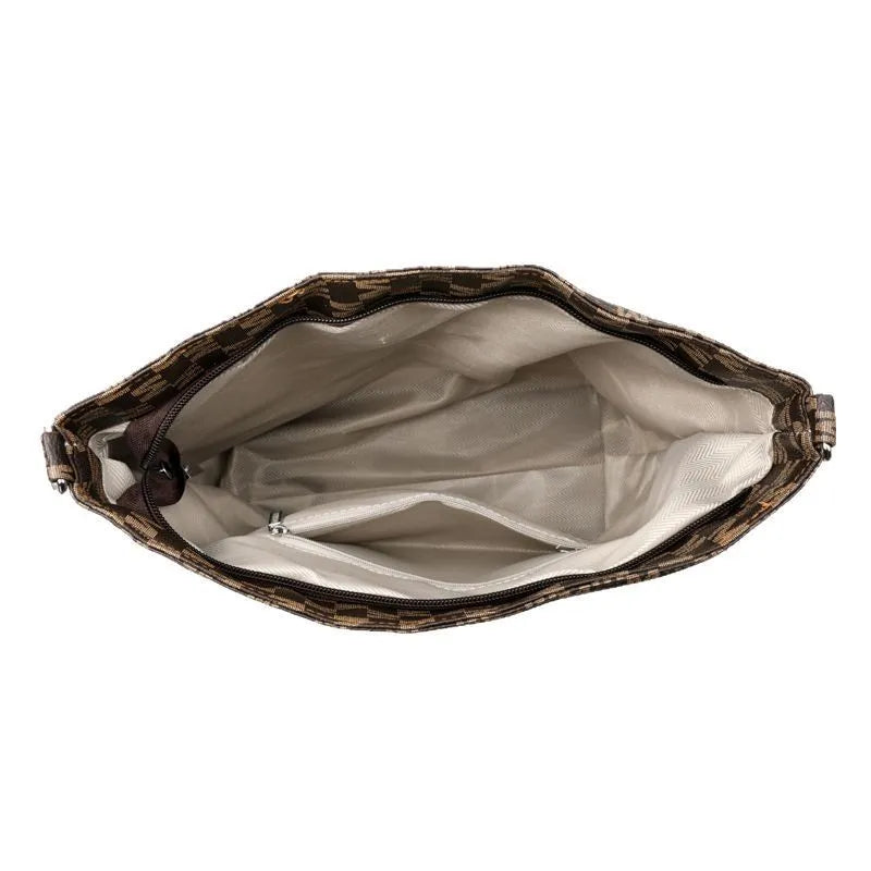 Black retro dumpling-shaped PU leather shoulder bag with an external sandwich pocket.