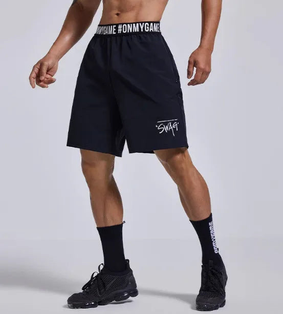 Men's loose black sports shorts with elastic waistband and letters design detail