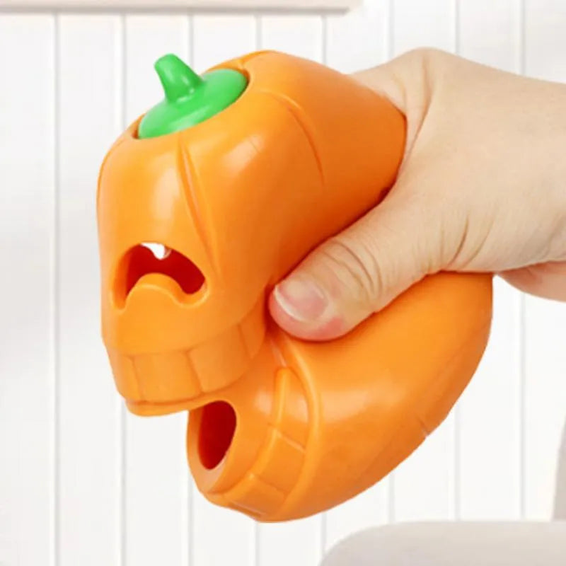 Yellow pumpkin-shaped dog chew toy made from TPR material measuring 8.6x11.5cm