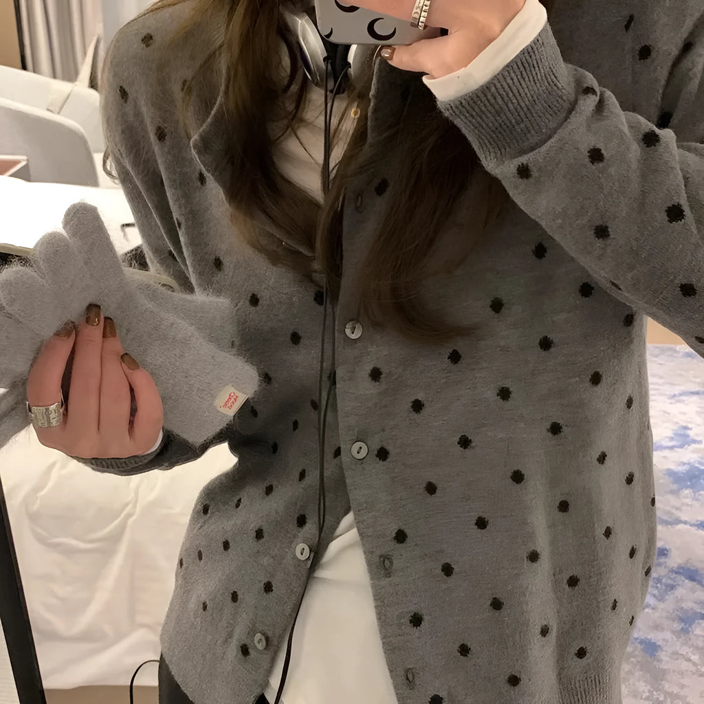 Grey dot crochet pattern on a loose-fit black women's viscose knitted cardigan.