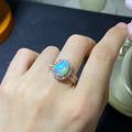 Handmade women's silver opal ring with an opening design, shown in a choice of colour plating.